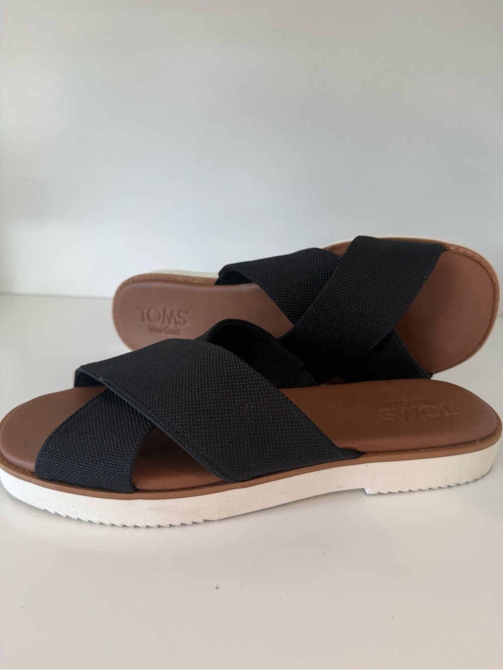 TOMS Black Slip-On Crisscross Sandals with Brown Footbed